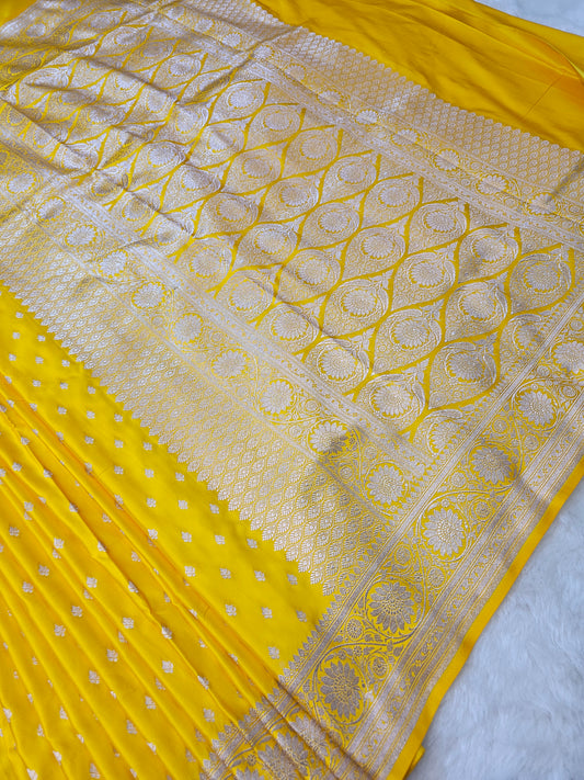BanarasiPremium Yellow Tissue Silk Saree with Silver Zari Floral Banarasi Weaving & Rich Paisley Pallu