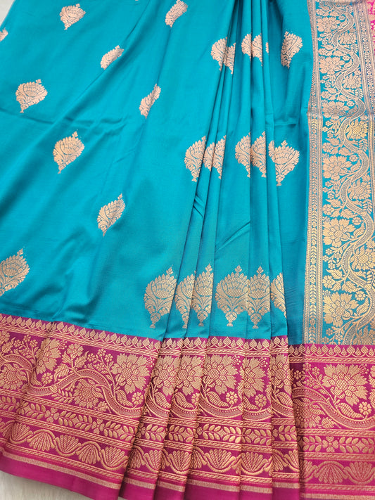 Banarasi Elegant Turquoise Blue Soft Katan Silk Saree with Magenta Contrast Border & Rich Zari Floral Weaving